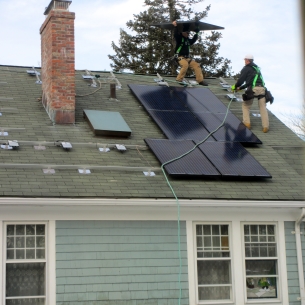 Installing solar panels on roof of house in Stamford, CT